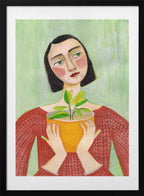 Woman Holding Green Plant, arte de Sharyn Bursic con marco