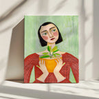 Woman Holding Green Plant, arte de Sharyn Bursic impreso en canvas