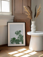 Fresh Green Monstera Leaves, arte de Pictufy Studio II enmarcado en una pared