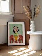Woman Holding Green Plant, arte de Sharyn Bursic enmarcado en una pared