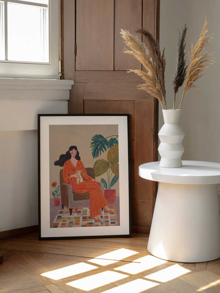 Woman with cat in living room with warm earth tones, arte de Caroline Bonne Müller enmarcado en una pared