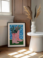 Pink Boots Green Plants, arte de Uma Gokhale enmarcado en una pared